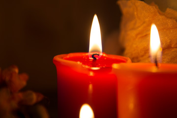 red candle in the dark