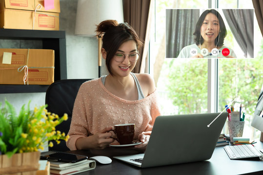 Asian woman work from home during corona virus, COVID-19 out break use laptop for teleconference with her teamates