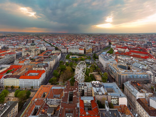 Fototapeta premium Europe hungary Budapest. Aerial panoramic cityscape about Budapest with epic sky. A Storm is comming on the background. Famous historical downtown in the foreground with ferris wheel.