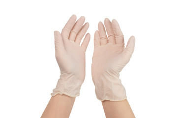 Woman puts on white rubber gloves.