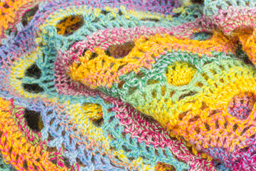 handmade multicolor crochet background with single crochet and double crochet stitches and chain stiches