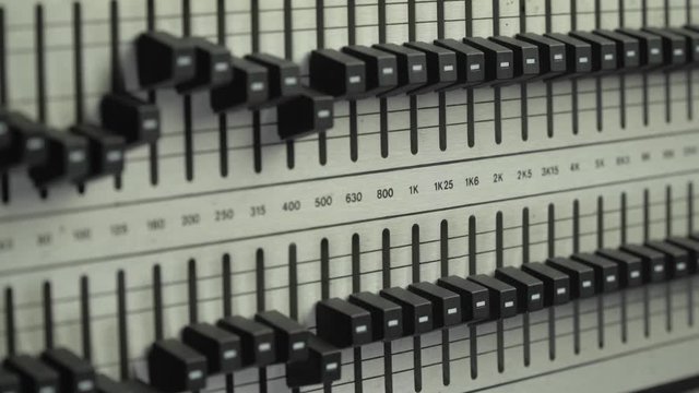 Sound engineer searching for feedback frequency