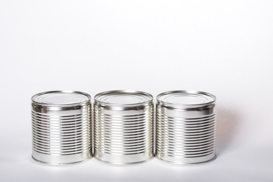 Metal cans on a white background. Three cans with conservation.