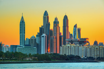 Fototapeta na wymiar Iconic and Luxury Dubai Marina - famous Jumeirah beach at sunrise, United Arab Emirates