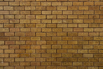 bricks red and broen color arranged in rows on wall