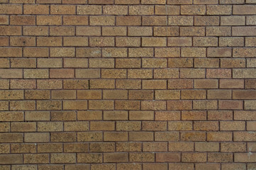 bricks red and broen color arranged in rows on wall