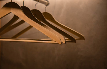 Hanger made of wood, arms in the cabinet with a concrete back.