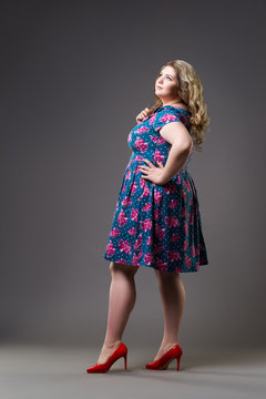 Plus Size Fashion Model In Floral Dress, Fat Woman On Gray Background