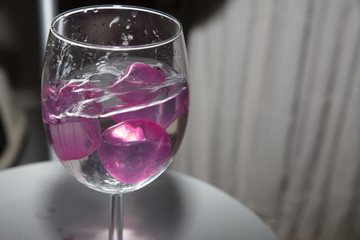  glass with ice cubes on white background