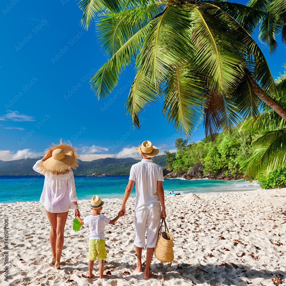 Poster Family with three year old boy on beach. Seychelles, Mahe.