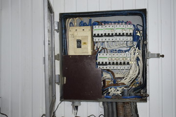 Switchboard for turning on and off the electricity. Metal box with toggle switches.