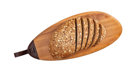 Isolated sliced bread with seeds and flakes on wooden oval cutting board on white background.