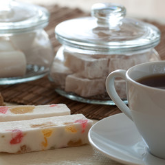 homemade cozy tea with sweets such as marshmallows, Turkish delight and pastille with colorful marmalade