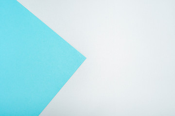 Minimalistic template with a geometric background with a big arrow and from multi-colored sheets of paper with a fine texture. Layout for brochures,  covers, magazines, invitations or presentations.