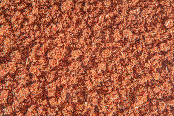 Background with scattered ground cinnamon at high magnification