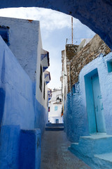 Ancient cozy street in blue and white in the kasbah - old part of city Chefchaouen, Morocco.