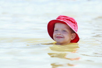 Little boy in sea