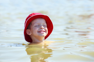 Little boy in sea