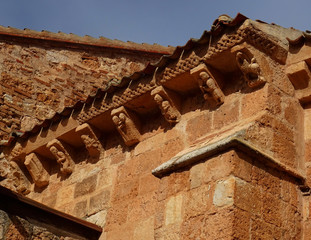 Detail of cornice and brackets of the Romanesque Church of San Miguel. (12 Century). Village of...