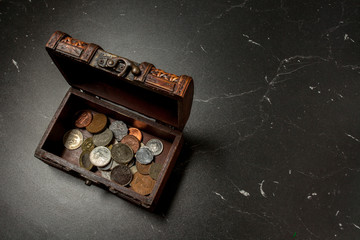 old coins collection in wooden chest box