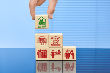 The concept of protection against covid-19 coronavirus. Six wooden cubes in descending order. The...