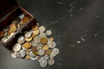 old coins collection in wooden chest box