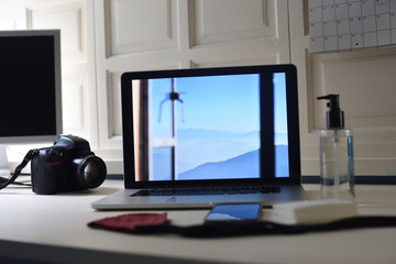 .Home photography workstation with camera, mask and gel.