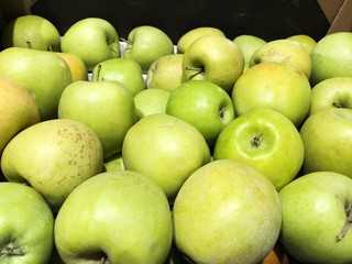 Fresh green apples on the market view