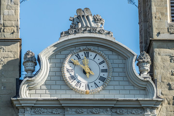 old clock on top of a building in Lucerne