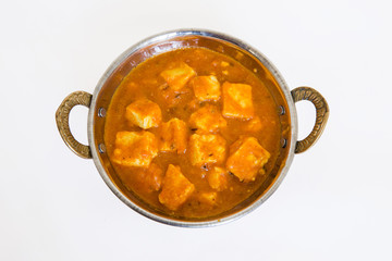 Homemade healthy and fresh shahi paneer or paneer lababdar or kadahi paneer served in a brass bowl made with lot of spices in traditional Indian style which tastes so yummy and delicious