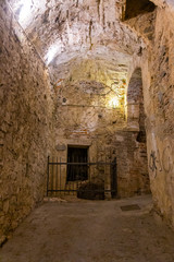 The stone walls of the casemates in an ancient fortress in Savona, Italy