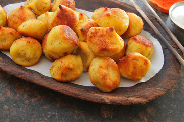 
dumplings, ravioli, fried with spices and sauce.