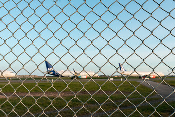 Grounded airplanes at the airport due to COVID19 ban on commercial flights in Europe.