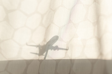 Silhouette of aircraft model on the curtain
