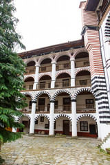 Orthodox Rila Monastery, a famous tourist attraction and cultural heritage monument in the Rila Nature Park mountains in Bulgaria