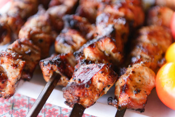 Ready kebab on the table. Grilled meat. Lunch cooked on coals.