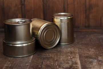 tin cans on a wooden background. blank for designers. a hike in fees