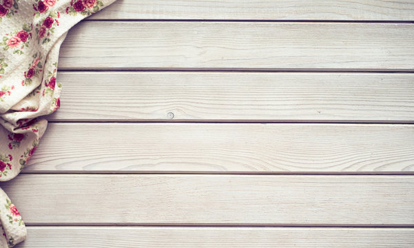 Vintage Kitchen Tablecloth On Rustic Wooden Table Made Of White Wood Planks. Textured Background With Copy Space For Your Advertising Text Message Or Promotional Content