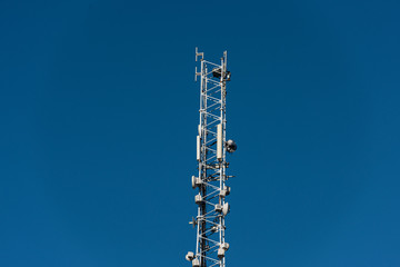 Communications pylon with cellular antennas and other communications equipment.