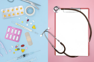 Top view of medicines and medical tools with stethoscope on pastel background, Medical and healthcare concept. Blank for text and copy space.