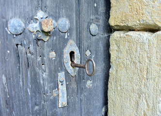 Old door keyhole with key