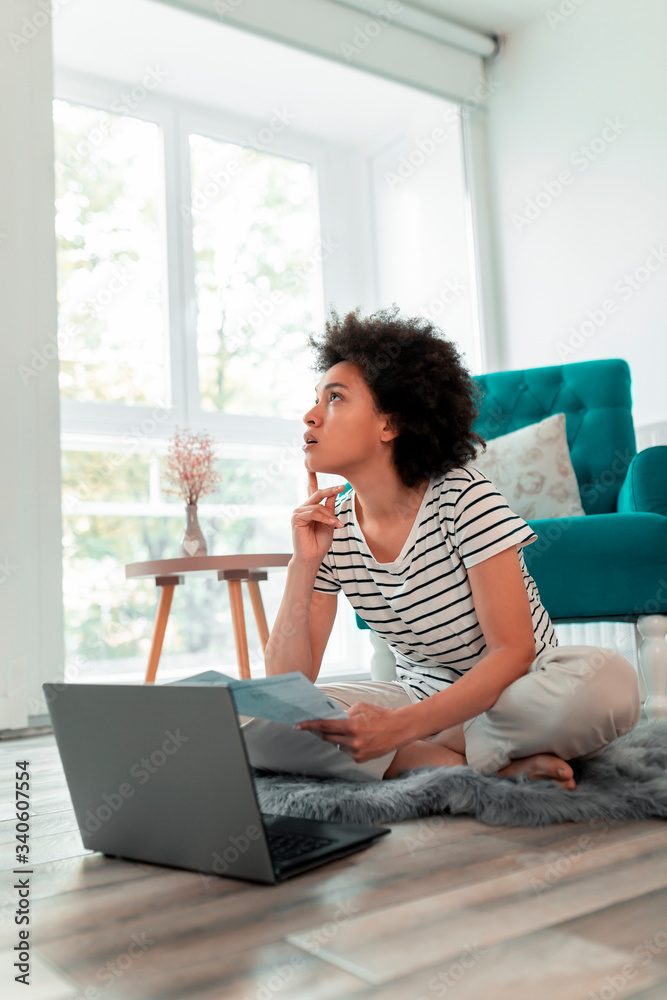 Wall mural Woman calculating bank loan payout rates