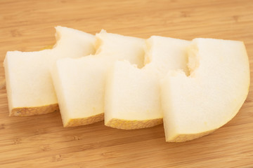 Fresh melon on a wooden board.