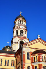 Fototapeta na wymiar Bell tower of New Athos monastery in August. Abkhazia