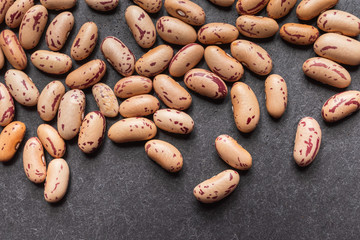 Fototapeta premium close up of cranberry beans with black background