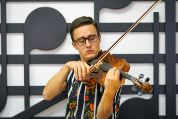 Young musician playing the violin, Close Up, Playing his handmade violin with great success