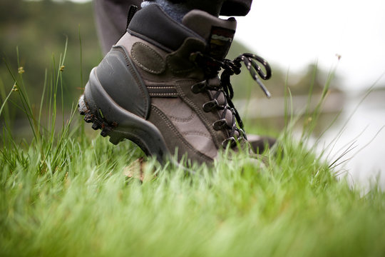 hiker boots walking in grass
