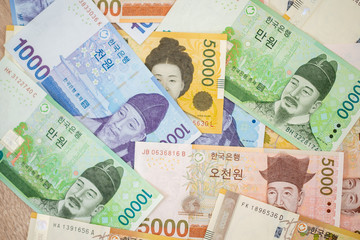 Current Use of South Korean Won Currency in Different value. Various bank notes placed. South Korean Won bank background.