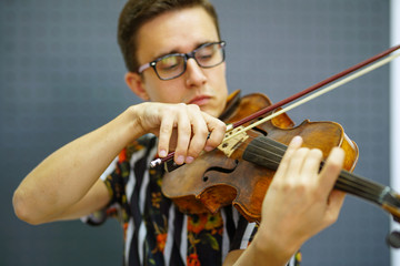 Playing his handmade violin with great success
