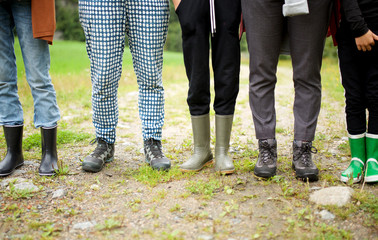 group of people standing with hiking boots